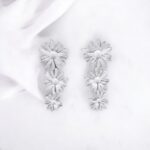 Pendientes triple flor plateado